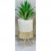 White vase with golden stand and flower