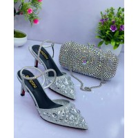 Women shoe silver colour with a beautiful clutch purse